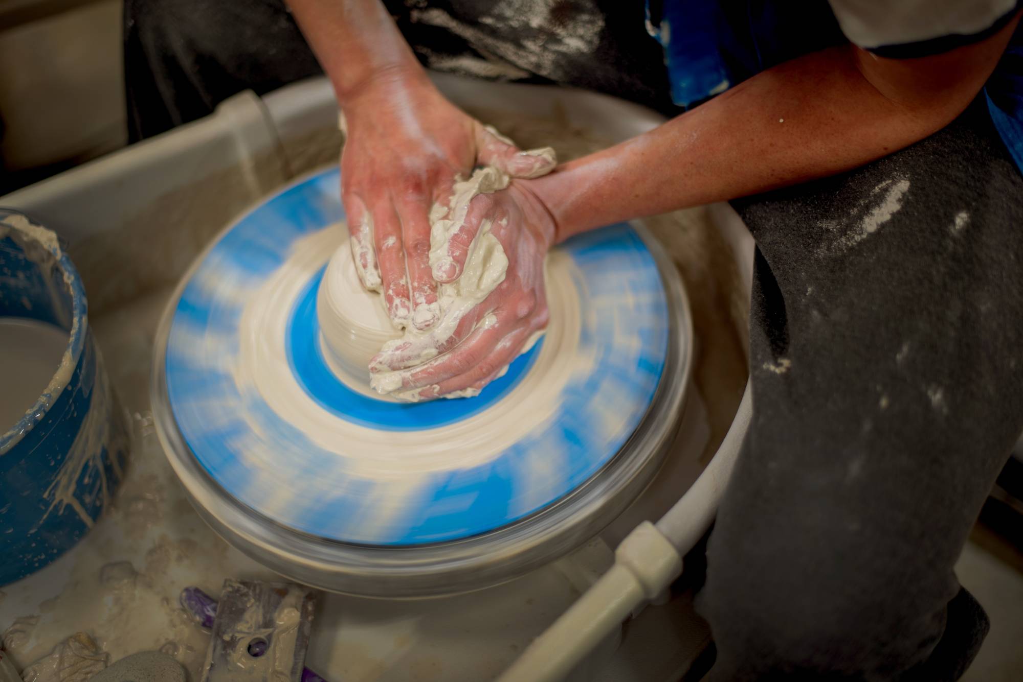 Veronica Clapp works on a two-part ceramics piece in the Calder Arts Center. &#8220;I like the history of it and working with my hands. It&#8217;s really satisfying,&#8221; she said. Clapp, a nontraditional GVSU student, said she was taking the class for fun.   (Photo release on file)
